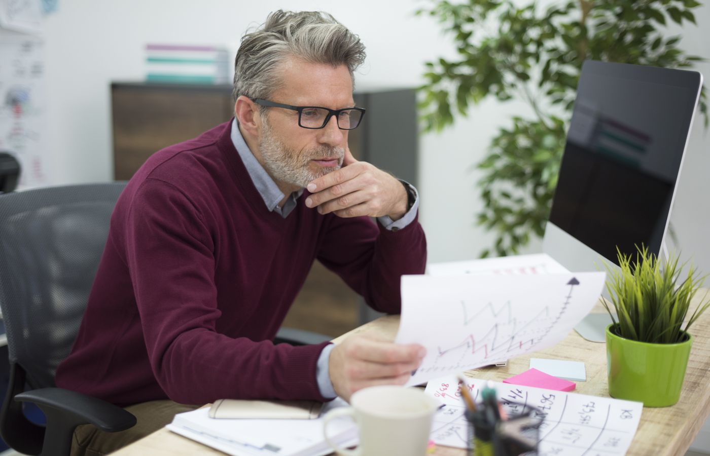 Accountant reviewing documents at his desk